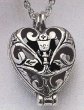 HEART PRAYER LOCKET WITH CUTOUT AND CHALICE DESIGN