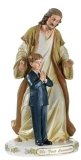COMMUNION BOY AND CHRIST STATUE
